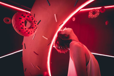 Portrait of woman with red light painting