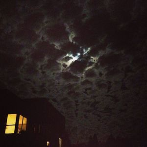 Low angle view of illuminated building against sky