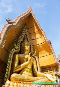 Low angle view of temple against building