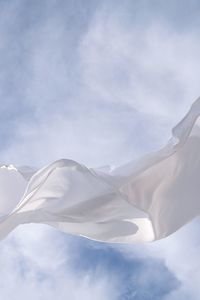 Low angle view of textile against sky