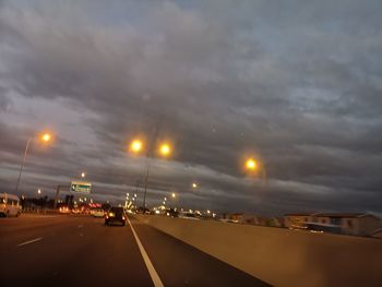 Cars on road at dusk