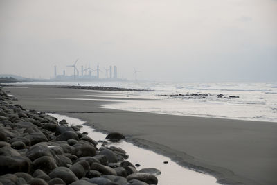 Scenic view of beach against sky