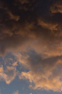 Low angle view of cloudy sky during sunset