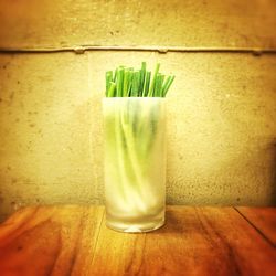 Close up of green leaf on wooden table