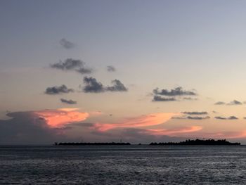 Scenic view of sea against sky at sunset