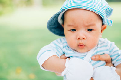 Portrait of cute baby boy wearing cap