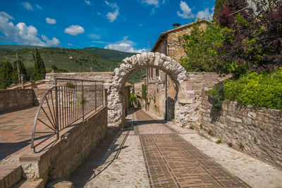 Ancient rocky arch over the alley in spello, umbria