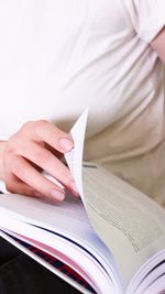 Close-up of hand holding book