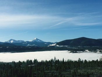 Scenic view of lake with mountain range in background