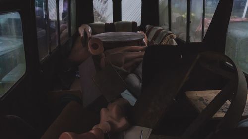 Midsection of man traveling in bus