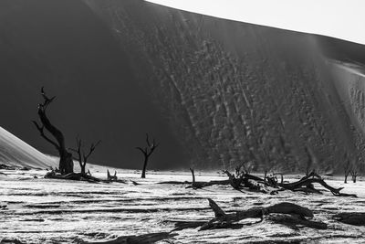Scenic view of snow covered land against sky
