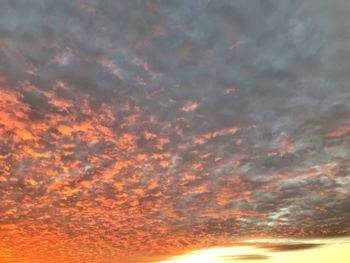 Low angle view of dramatic sky during sunset