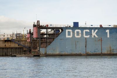 Commercial dock at port of hamburg against sky