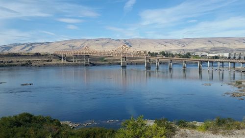 The dalles bridge over river columbia against mountains