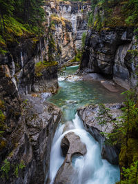 High angle view of waterfall in forest maligne canyon in jasper national park