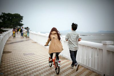 Couple standing on railing