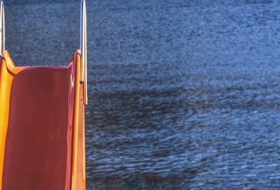 Close-up of yellow boat on beach