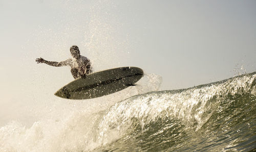 Man surfing on sea