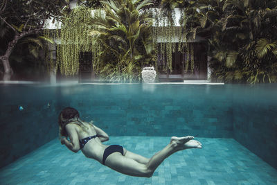 Woman swimming in pool