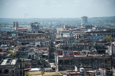 High angle view of buildings in city against sky