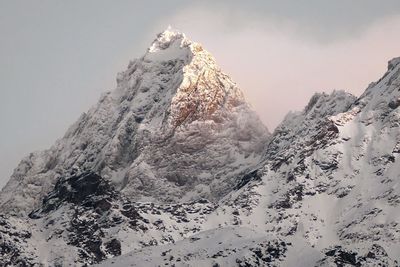 Snow covered mountain against sky