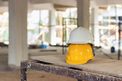 Hardhats on table in old building
