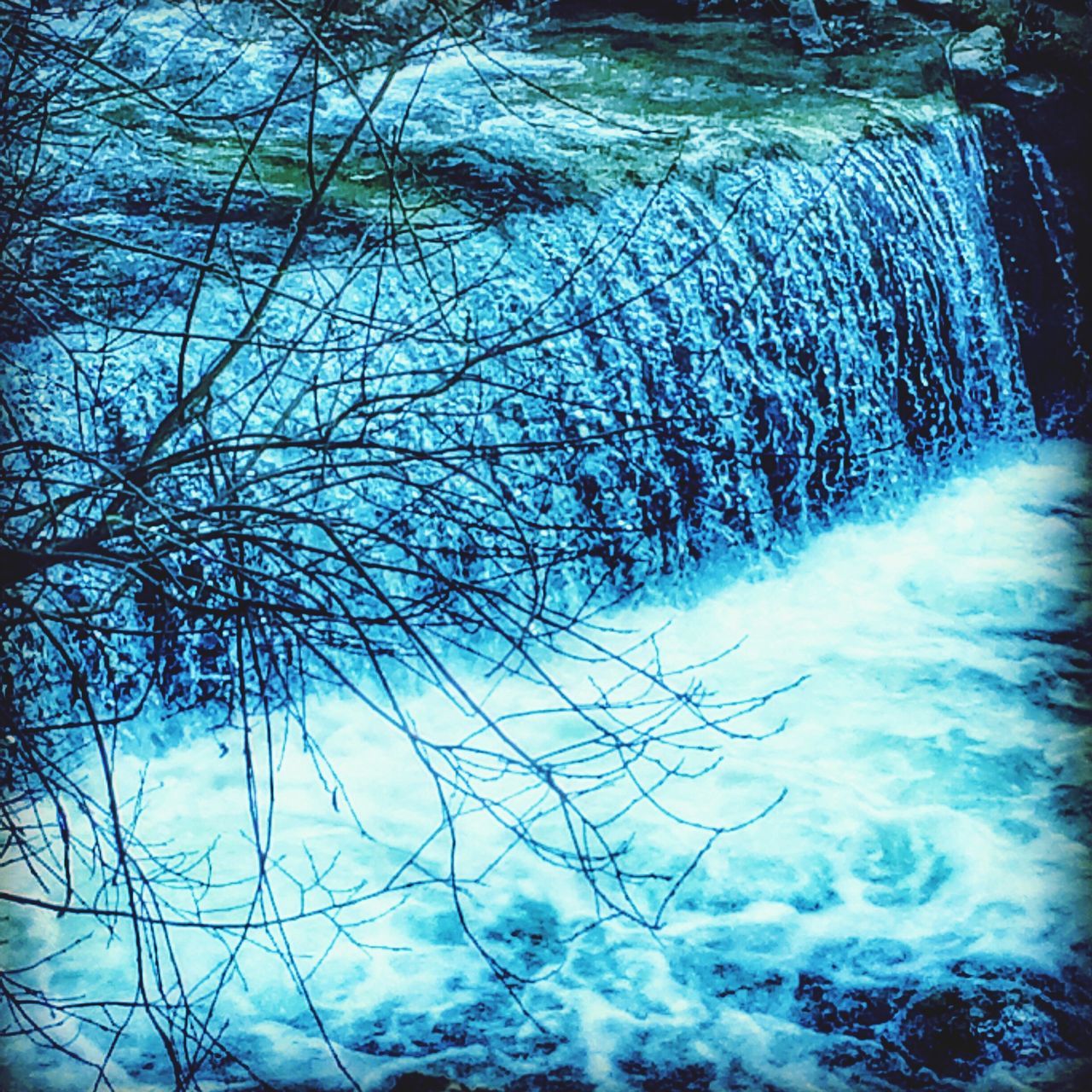 water, motion, flowing water, waterfront, nature, beauty in nature, long exposure, scenics, tree, waterfall, flowing, rippled, reflection, tranquility, splashing, day, river, blue, outdoors, bare tree