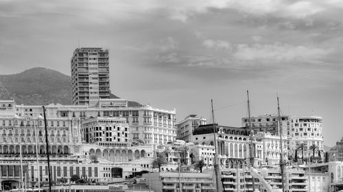 Buildings in city against sky