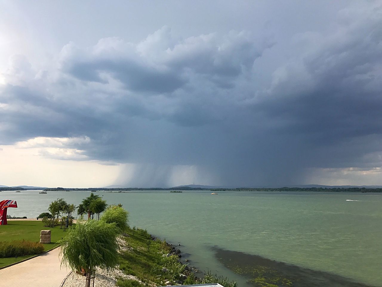 sea, water, cloud - sky, sky, nature, scenics, horizon over water, beauty in nature, day, outdoors, tranquility, no people, storm cloud, beach, tree, architecture, thunderstorm