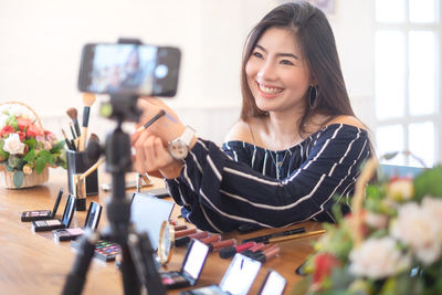 Portrait of young woman smiling