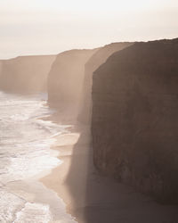 Scenic sunset view of twelve apostle cliffs against sky