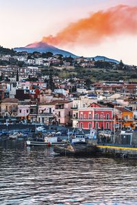 Aerial view of houses and mountains against sky