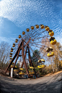 Low angle view of ferris wheel against sky