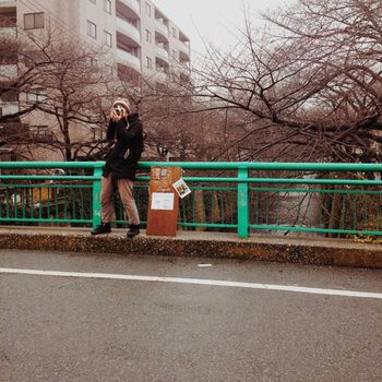 WOMAN WALKING ON ROAD