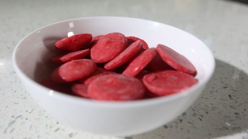 High angle view of strawberries in bowl on table