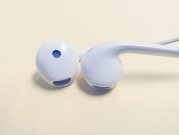 Close-up of electric lamp over white background