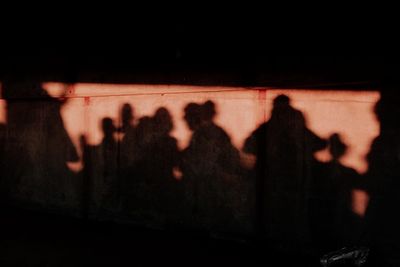 Shadow of people on illuminated floor