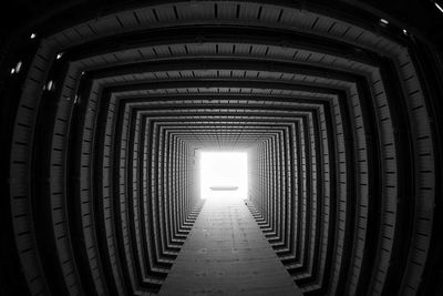 Low angle view of illuminated tunnel