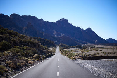 Surface level of road against mountain range