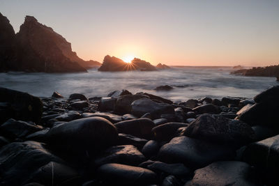 Scenic view of sea against clear sky during sunset