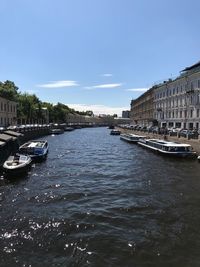 View of river in city against sky