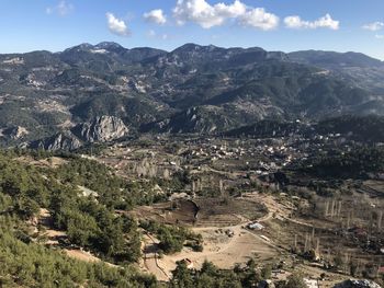 High angle view of townscape and mountains against sky