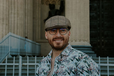 Portrait of smiling young man outdoors