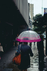 People in wet street during monsoon