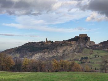 Scenic view of landscape against cloudy sky