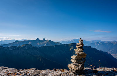 Scenic view of mountains against clear blue sky