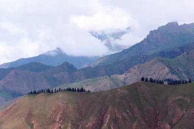 Scenic view of landscape and mountains against sky