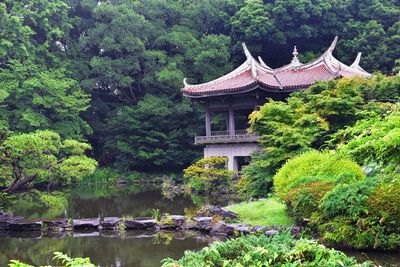 Temple by lake in forest