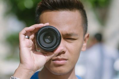 Woman photographing through camera