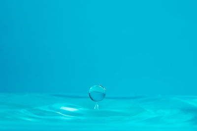 Close-up of water drop on swimming pool